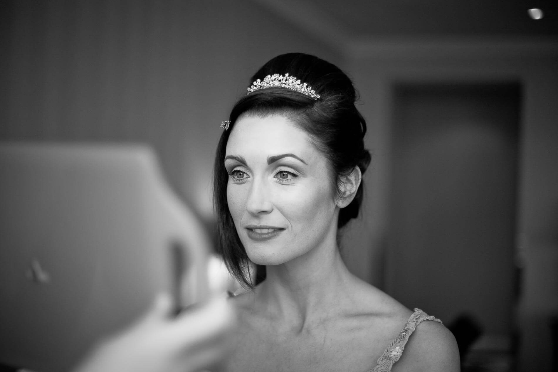Bride looking at her makeup