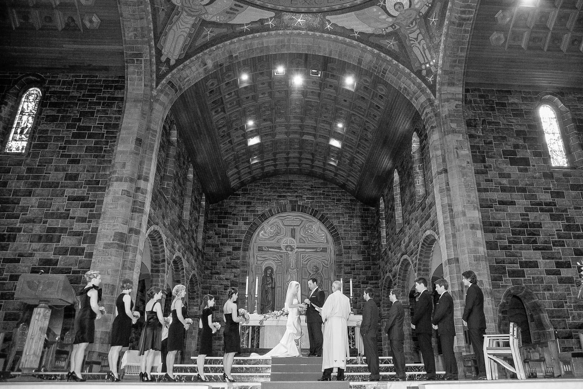 Bride and groom saying vows on altar