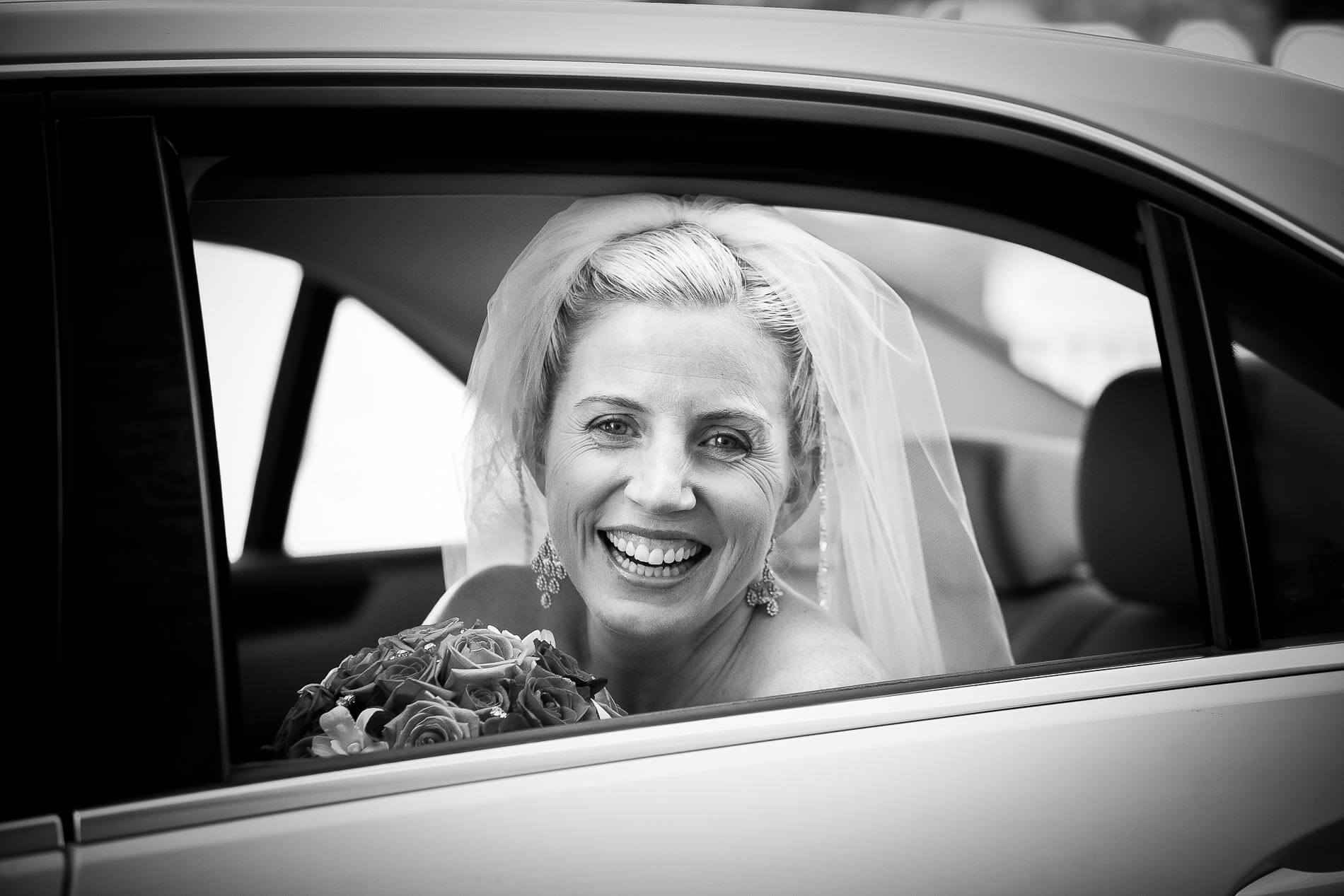 Bride arrived at church posing in wedding car