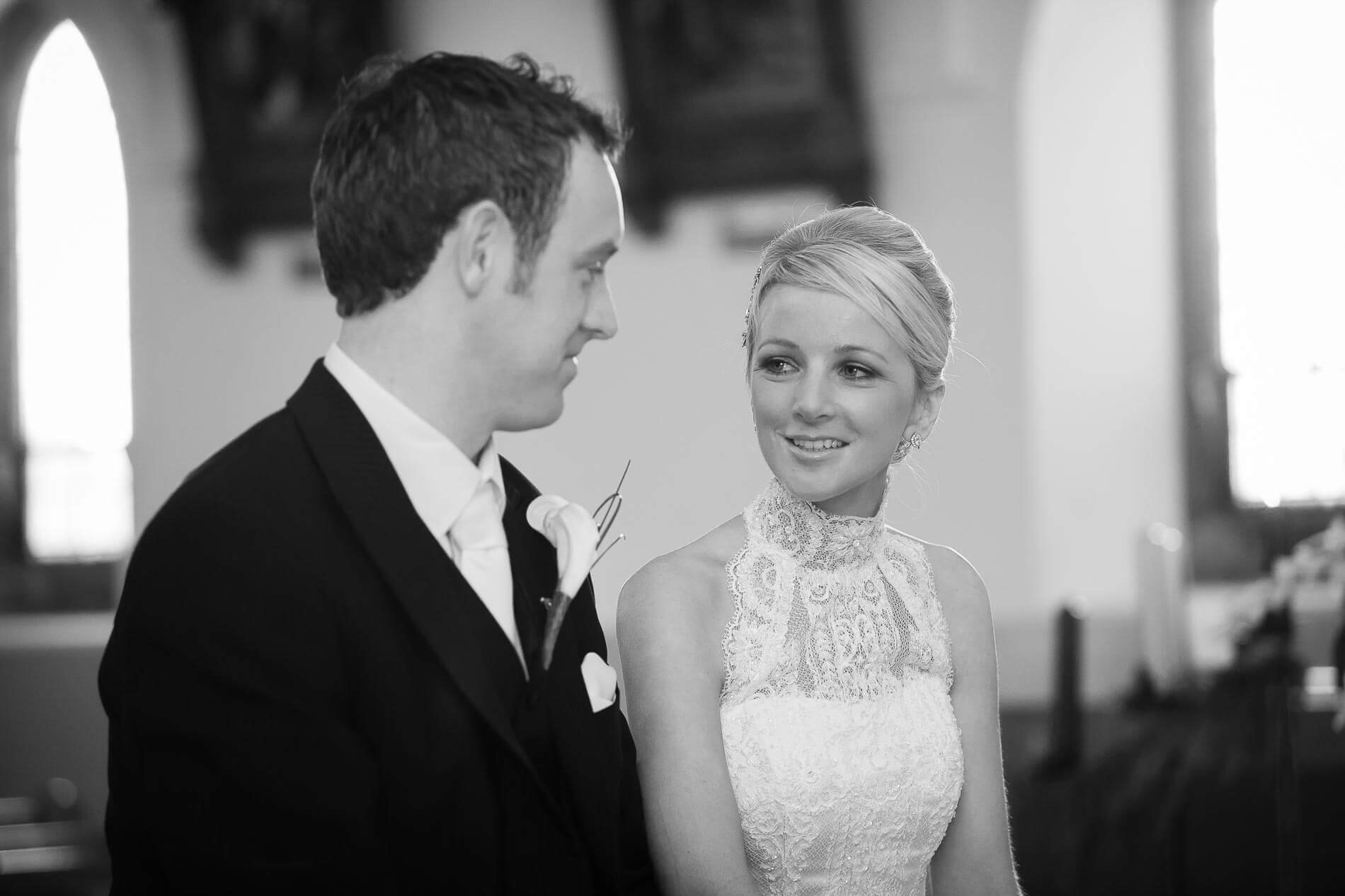 bride and groom briefly chatting to each other during wedding